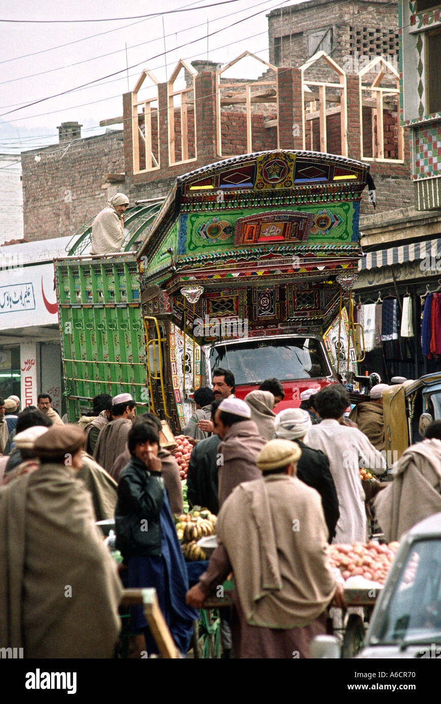 Pakistan Swat Valley Mingora decorated truck passing through bazaar Stock Photo