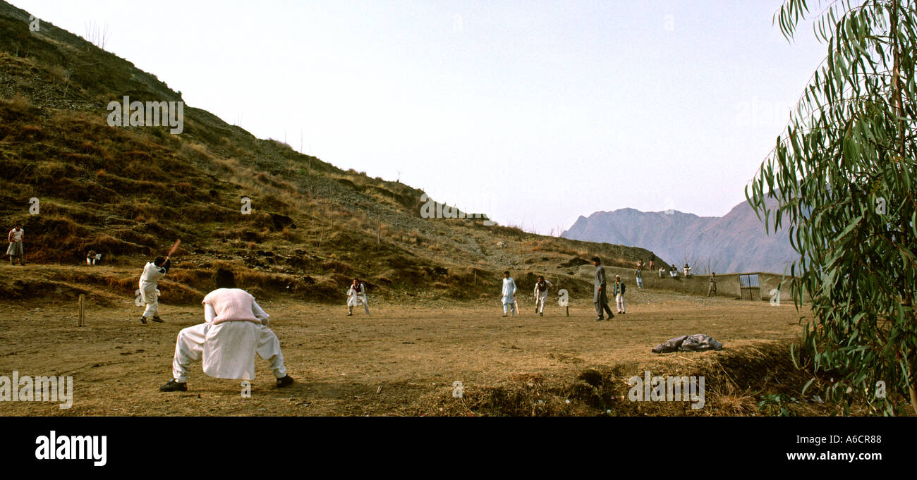 Pakistan Swat Valley Mingora young men playing cricket in hills Stock Photo