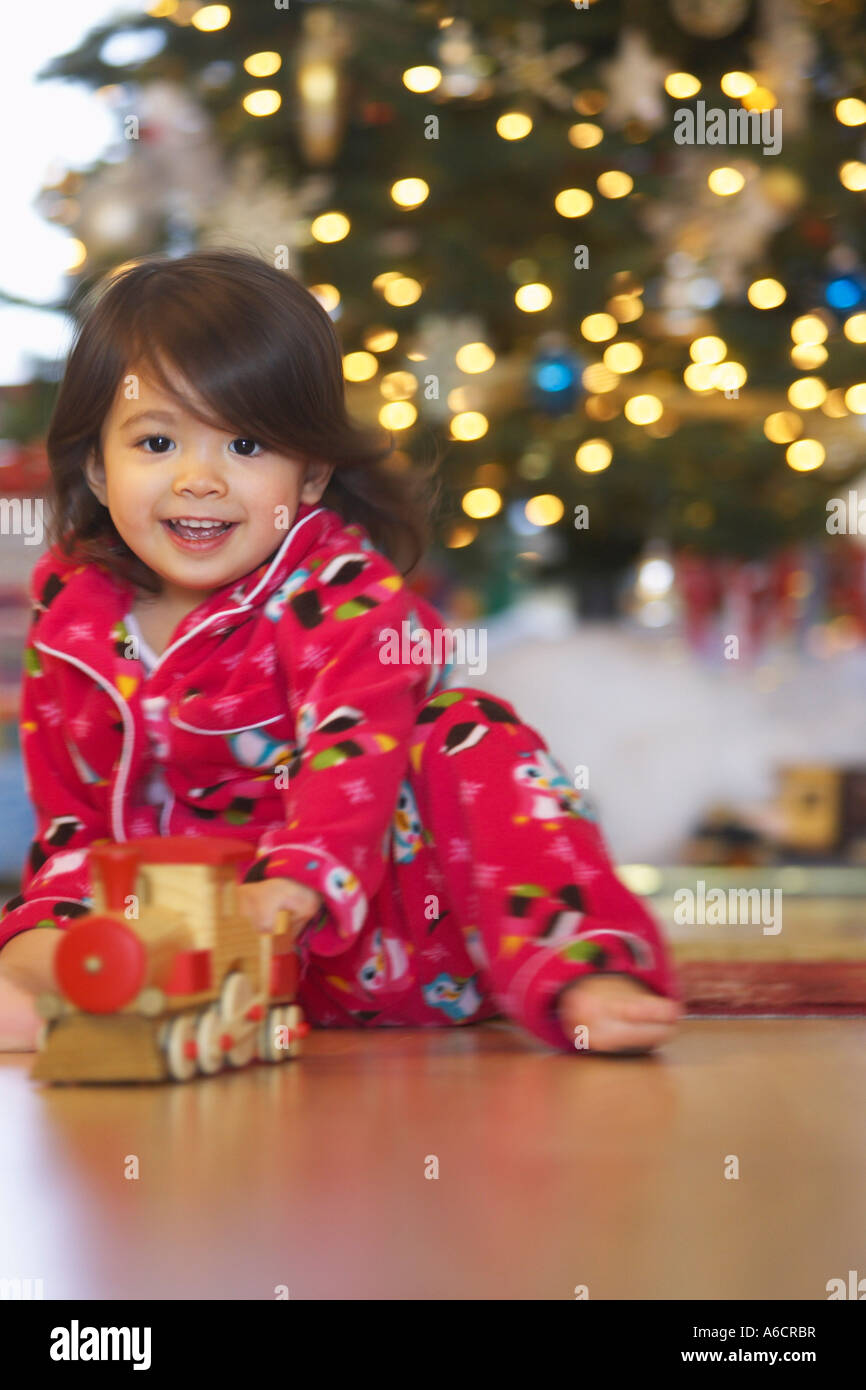 Little Girl Playing with Toy Train on Christmas Morning Stock Photo - Alamy