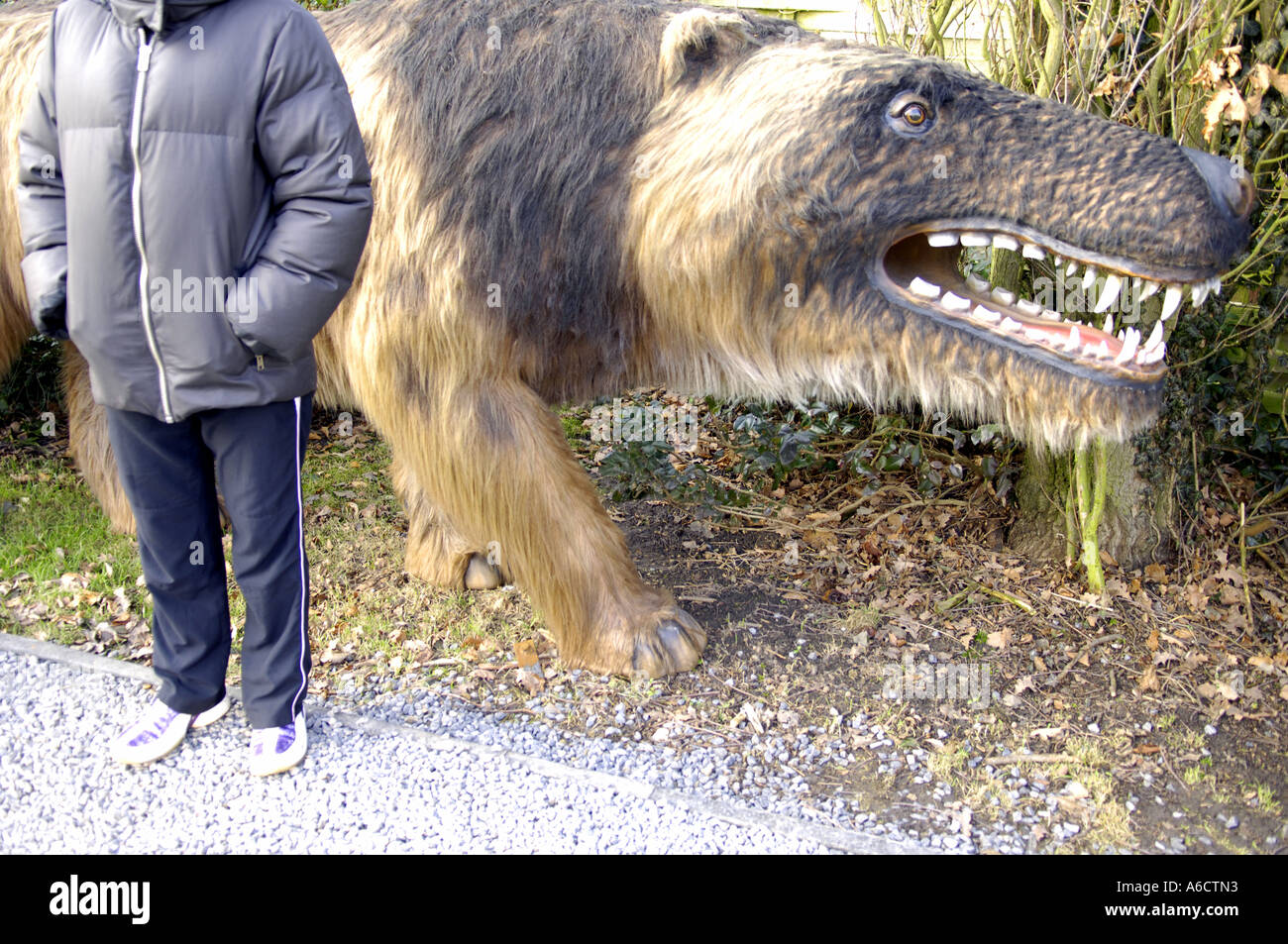 prehistoric large rodent rat ratlike brown vicious teeth girl figure