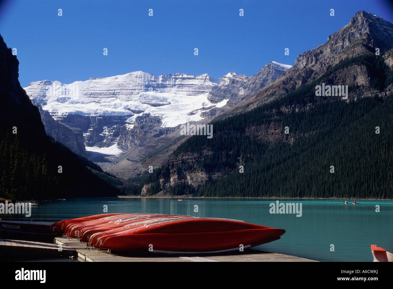 Banff Dock Canoes in a row on a dock, Lake Louise, Banff National Park, Alberta ...