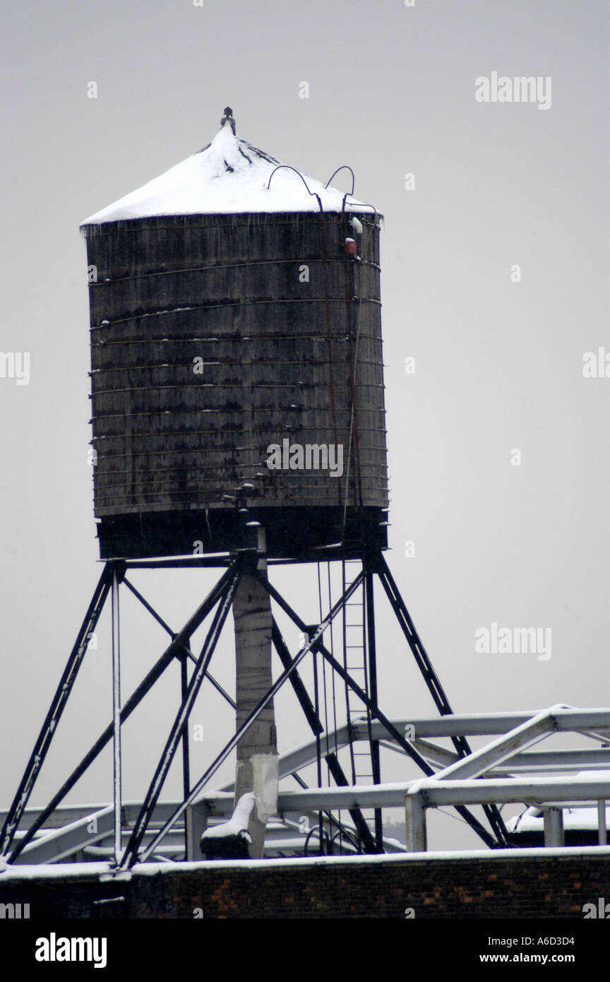 Water tower tank struts roof winter snow NY vertical Stock Photo Alamy