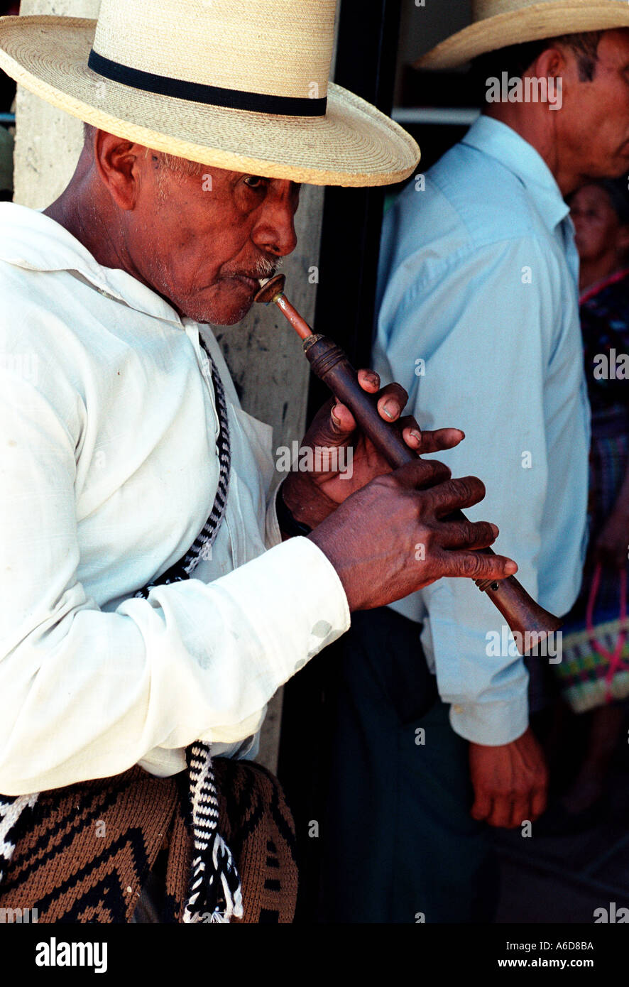 Saint s Day San Martin Jilotepeque Guatemala Man playing a chirimia during the procession Stock Photo