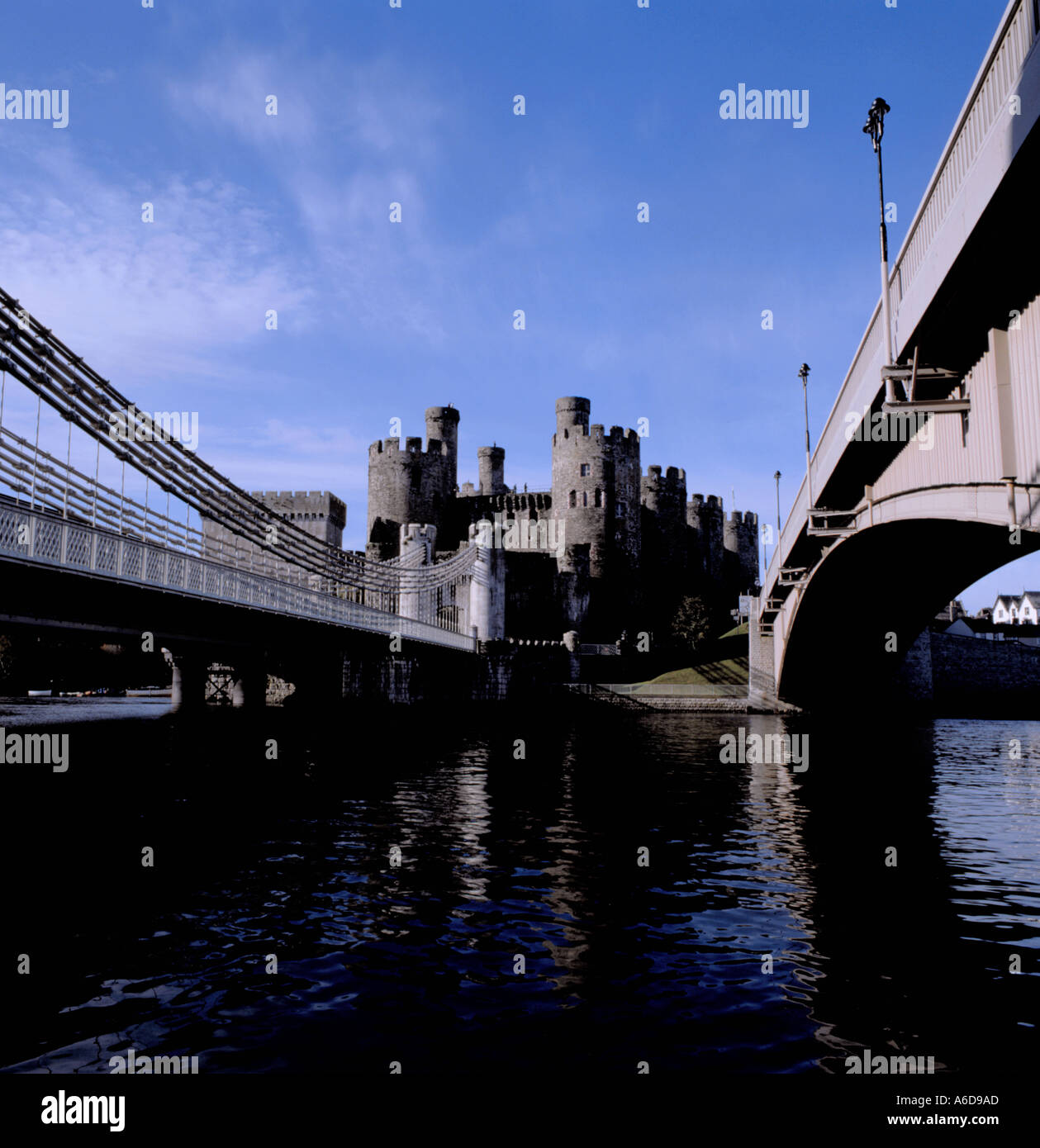 Conwy Castle, and old (suspension) and new [steel box section arch] road bridges over River Conwy, Conwy, Gwynedd, Wales, UK Stock Photo