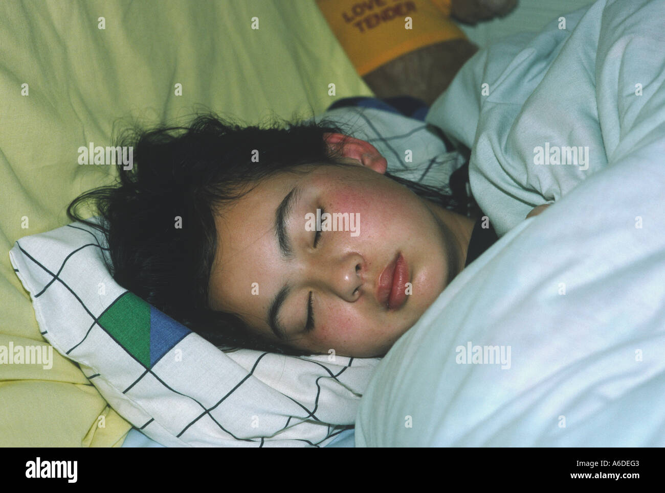 16330 ten 10 year old girl sleeping Stock Photo