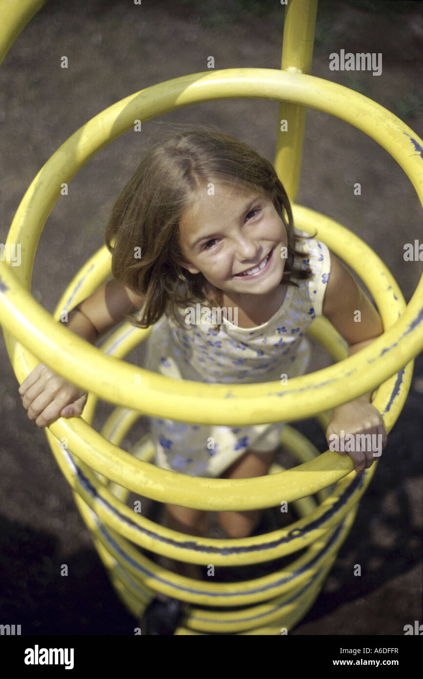 Portrait of a girl playing at a playground Stock Photo - Alamy