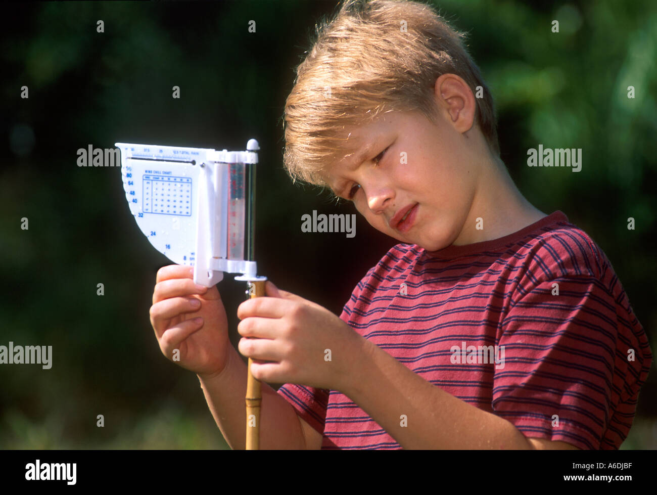 Boy with weather station science learning wonder child MR PR Stock Photo