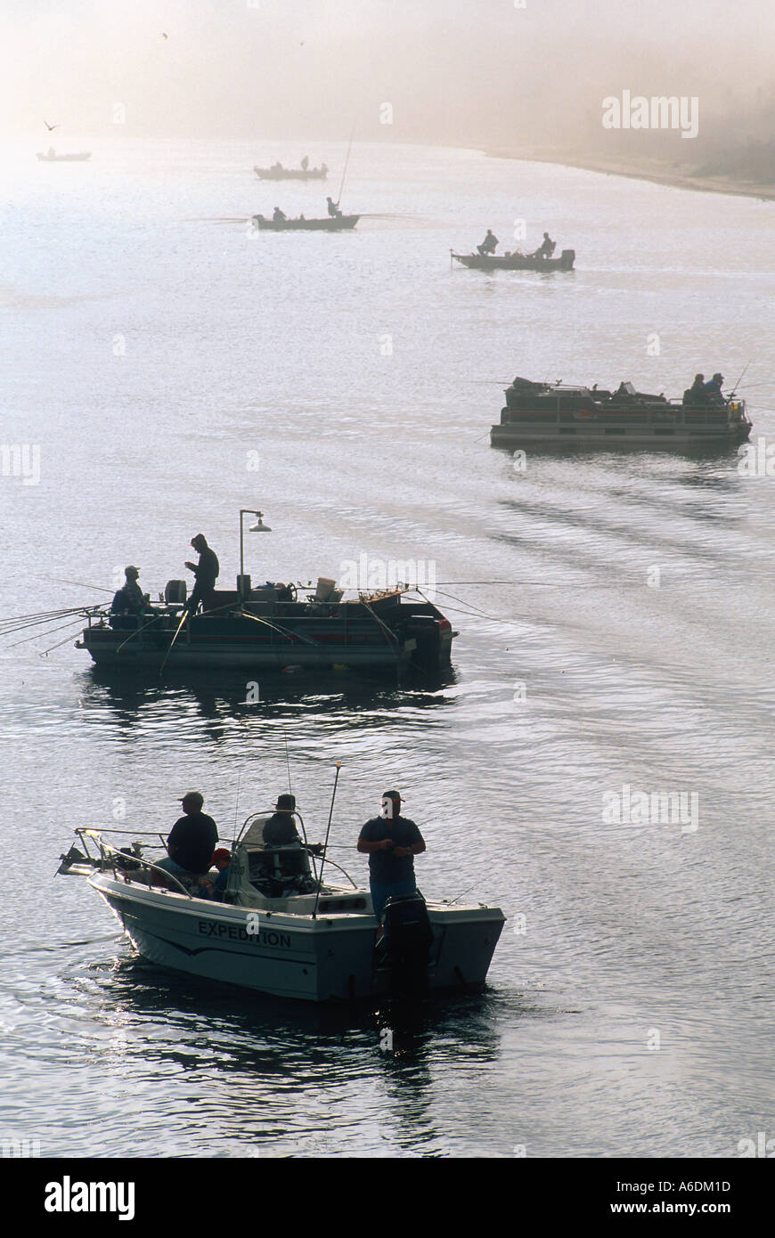 Boats with fishermen on the Kissimmee River near the mouth to Lake