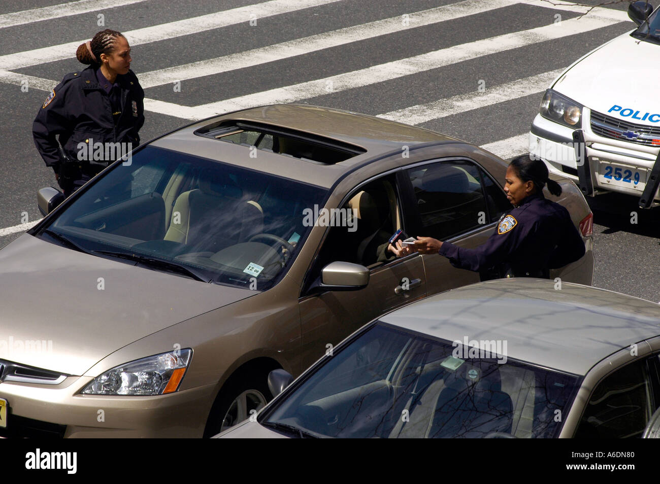 Female African American NYPD officers stop car for running red light