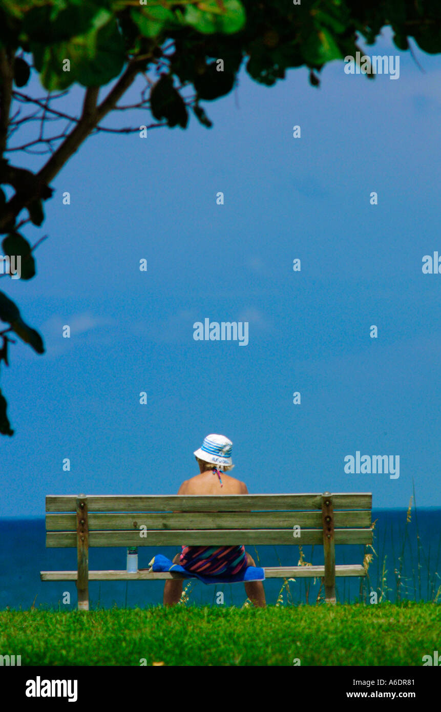 women sitting on a bench looking out at the ocean Relaxing beach ocean ...