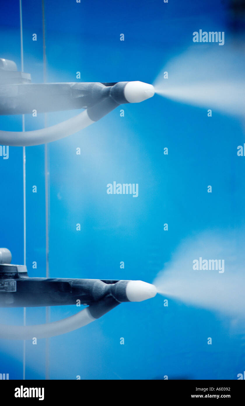 Spray heads apply finish in manufacturing process Stock Photo Alamy