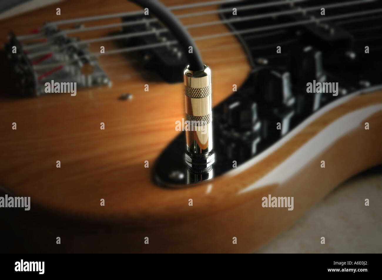 Plugged in to bass guitar Stock Photo Alamy