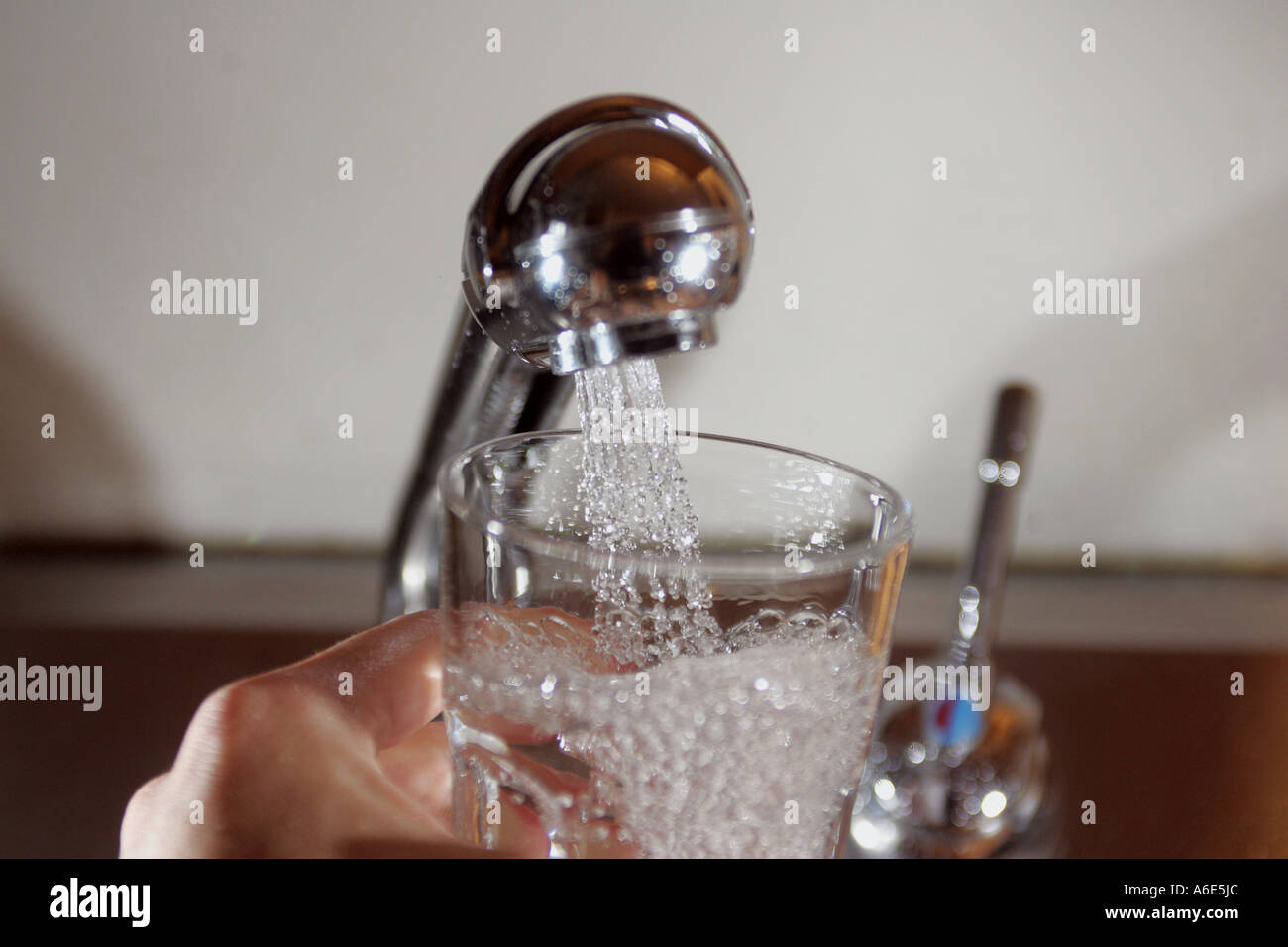 Drinking water pouring into glass, tap Stock Photo