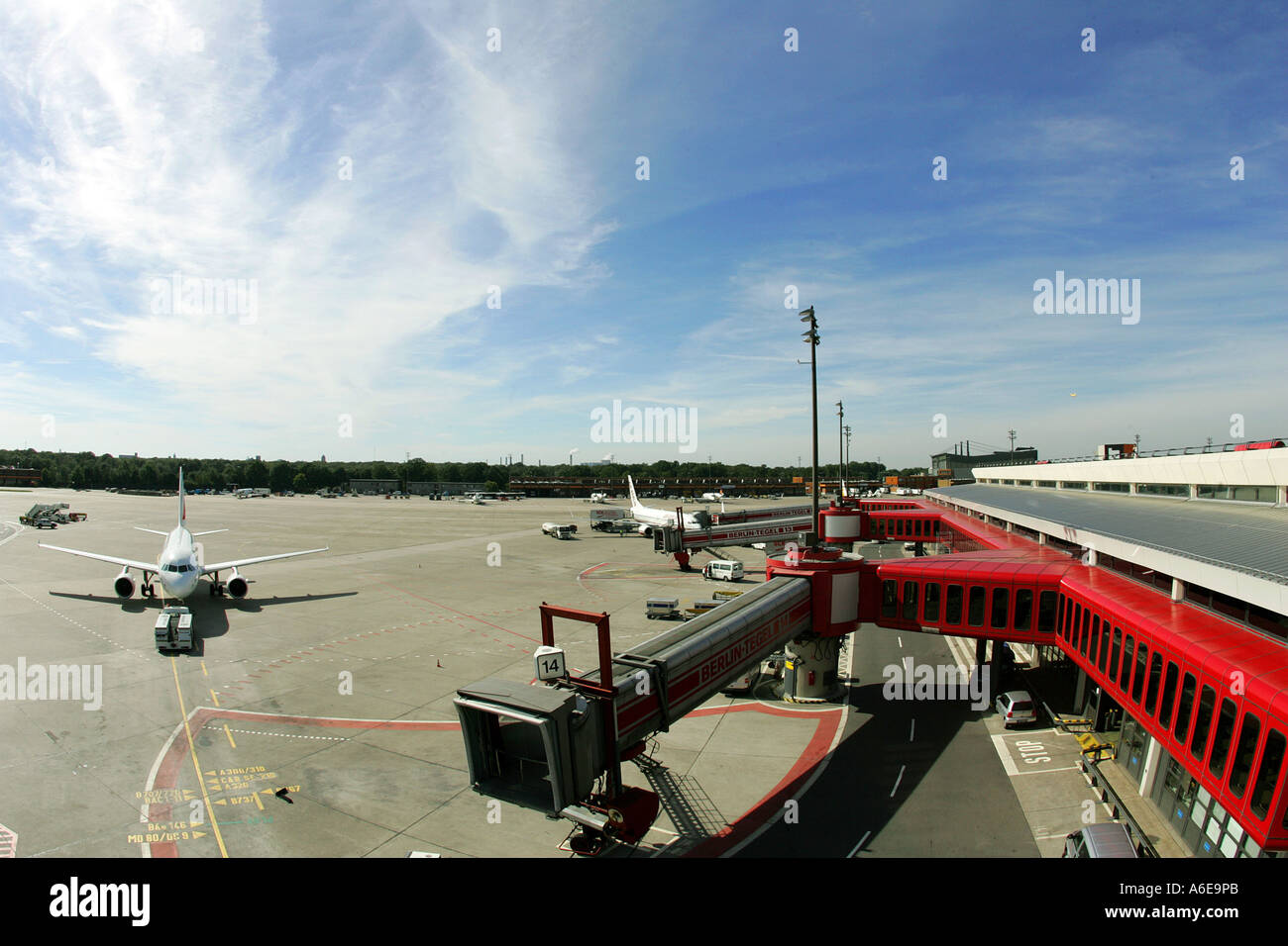 Airplane and boarding bridge at Tegel airport, Berlin Stock Photo