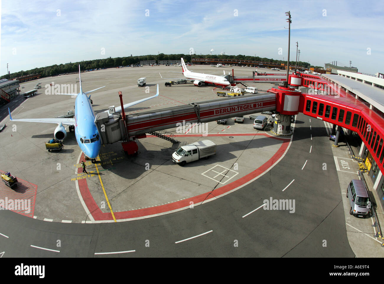 Airplane at boarding bridge at Tegel airport, Berlin Stock Photo