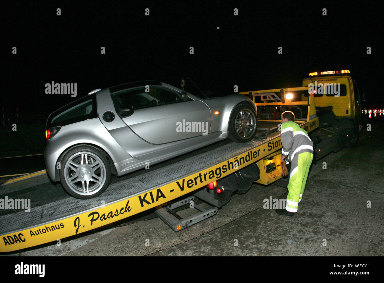 ADAC pulls smart coupe roadster on the haulers loading space Stock Photo