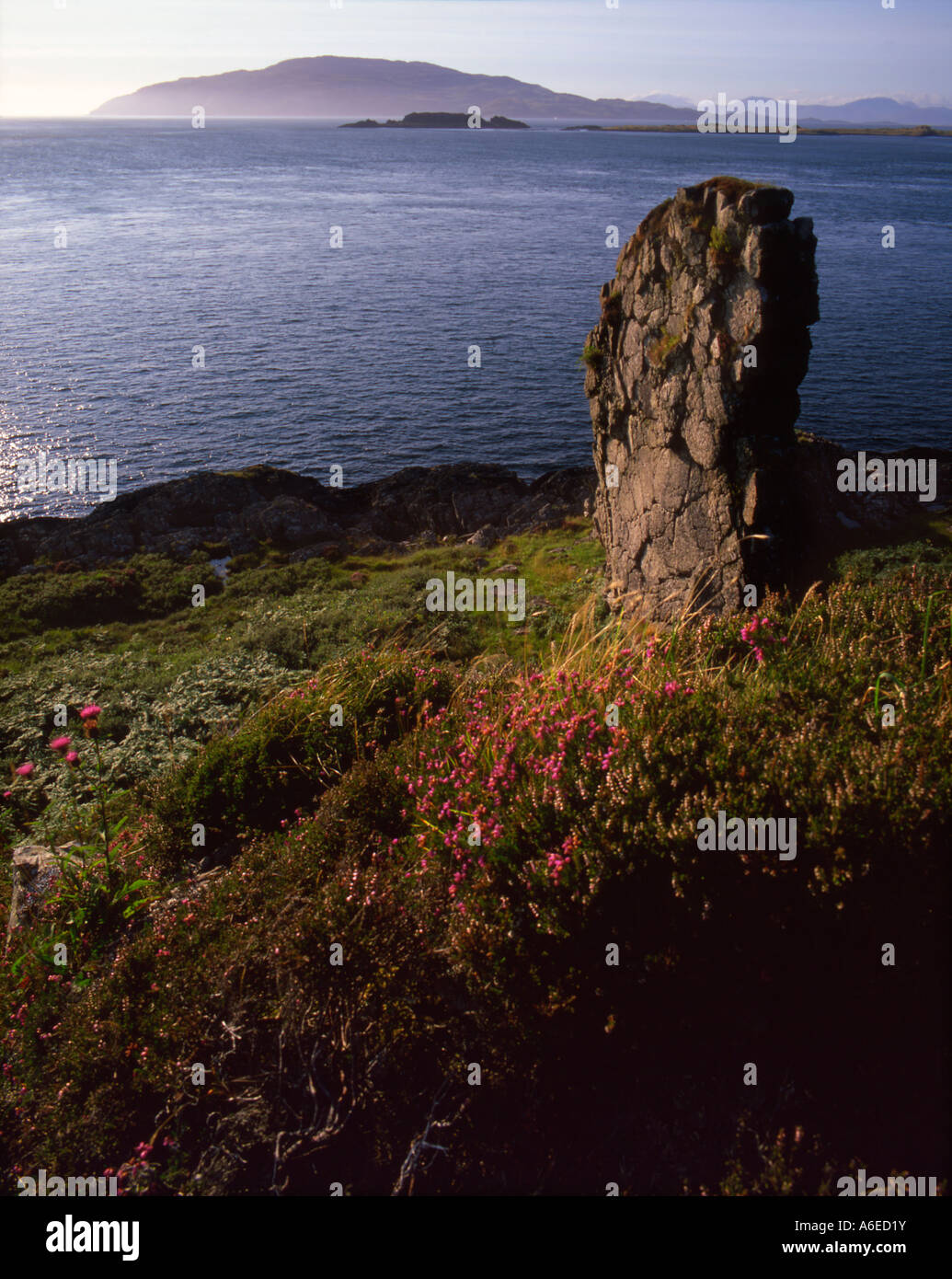 Scarba viewed through summer haze from Craignish point, Argyll Stock Photo