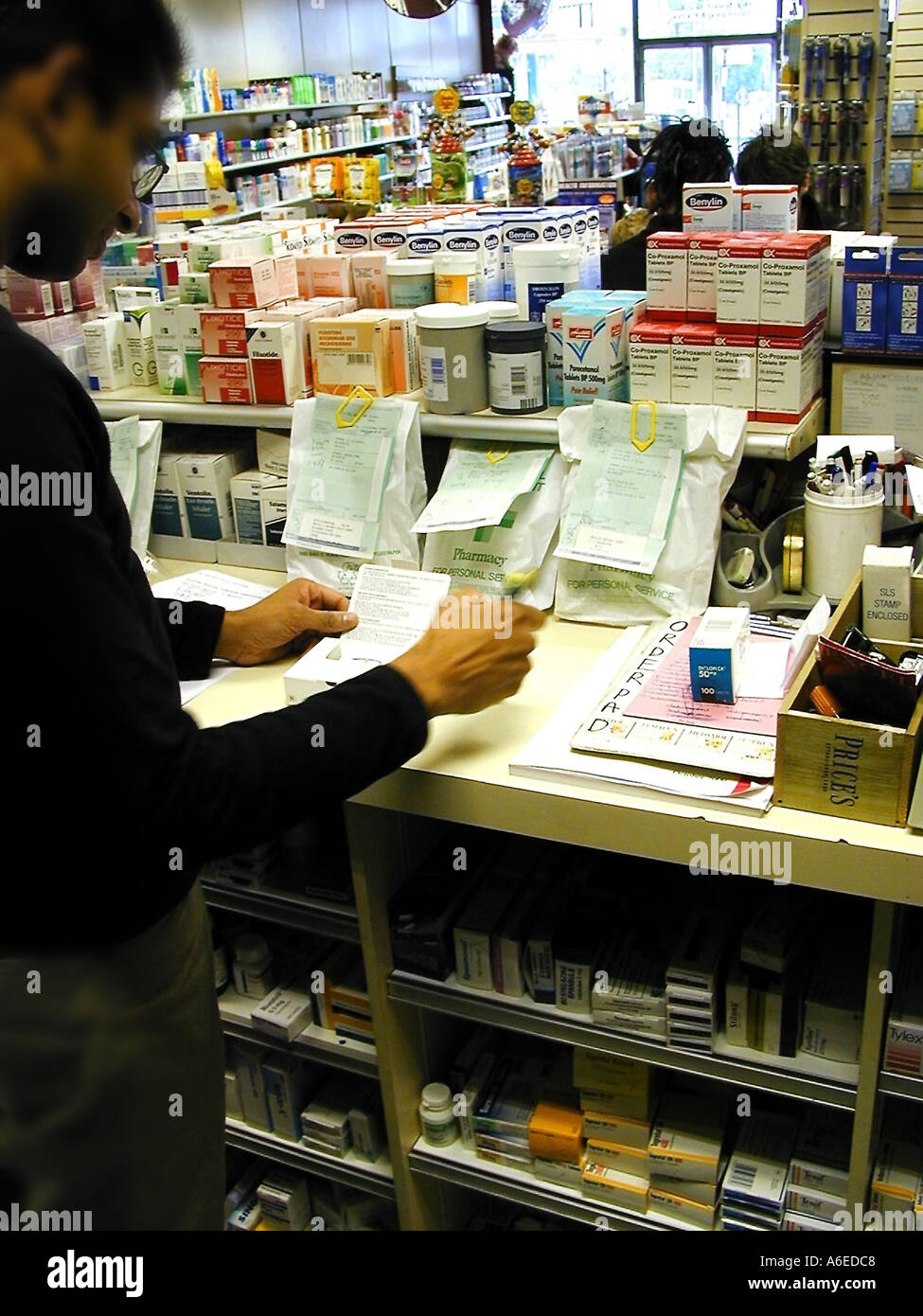 Pharmacist behind counter hi-res stock photography and images - Alamy