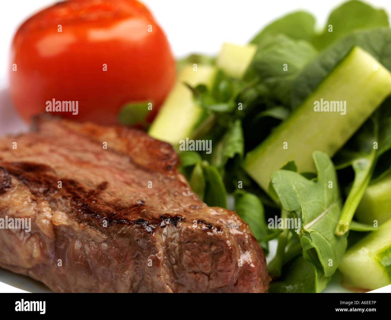 Freshly Grilled Lean Rump Steak with Salad Against A White Background With No People Stock Photo