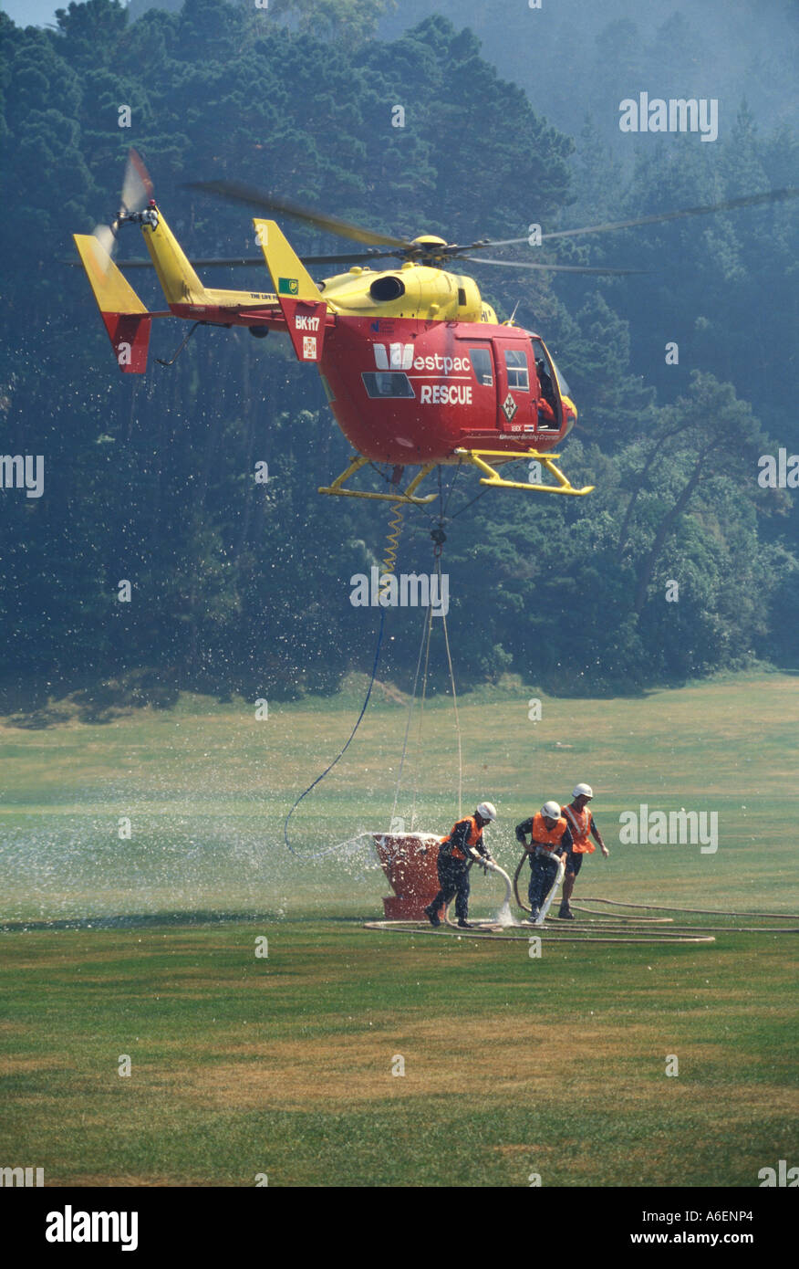 The Westpac Rescue Helicopter with monsoon bucket fights a fire in Wellington New Zealand Stock Photo