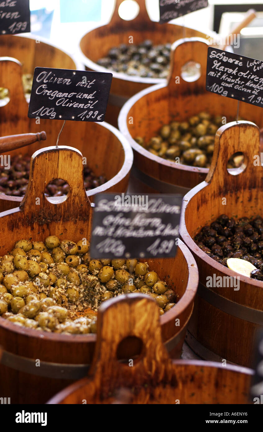 Wood troughs with preserved olives Stock Photo