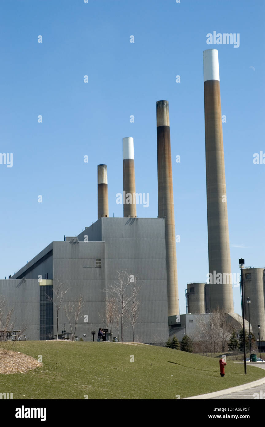 Four smoke stacks of a coal fire generating station Stock Photo