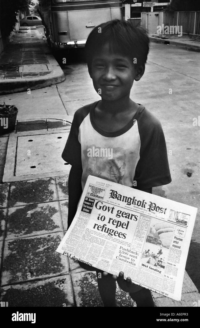 Young boy selling newspapers Black and White Stock Photos & Images Alamy