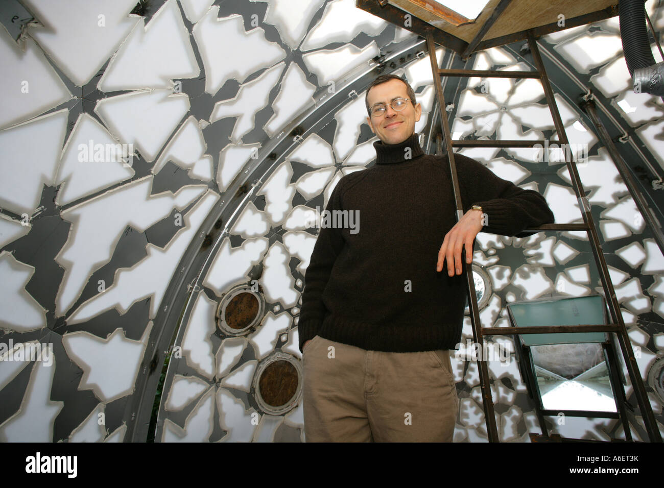 Sculptor MICHAEL CONDRON standing inside his giant Christmassy work of art, Braintree, Essex, England, UK Stock Photo