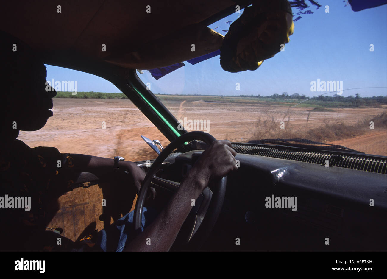 taxi driver drives a passenger in Gambia West Africa Stock Photo - Alamy