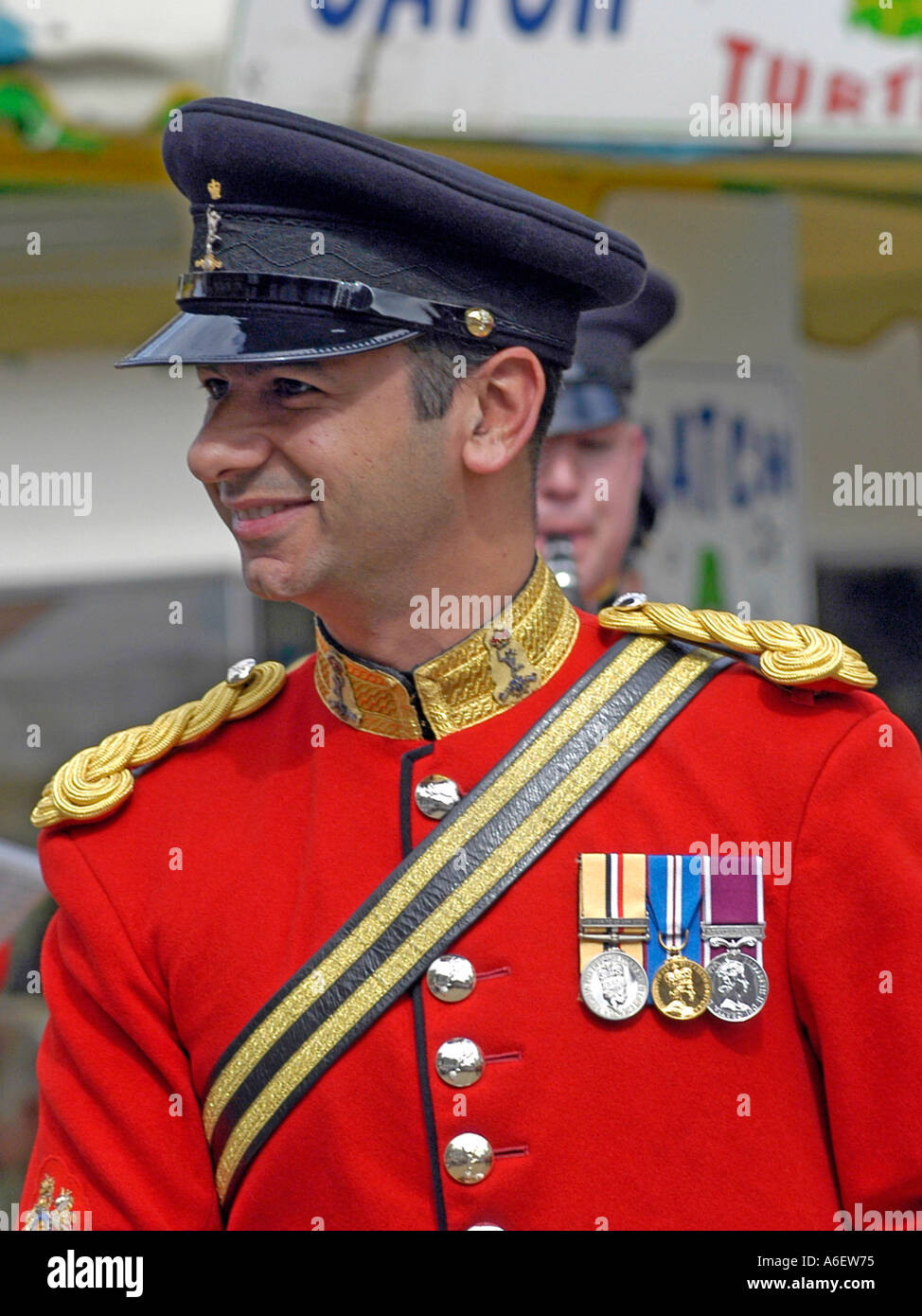British Army Officer wearing a red tunic and medals at a cerimonial fuction in London Stock Photo