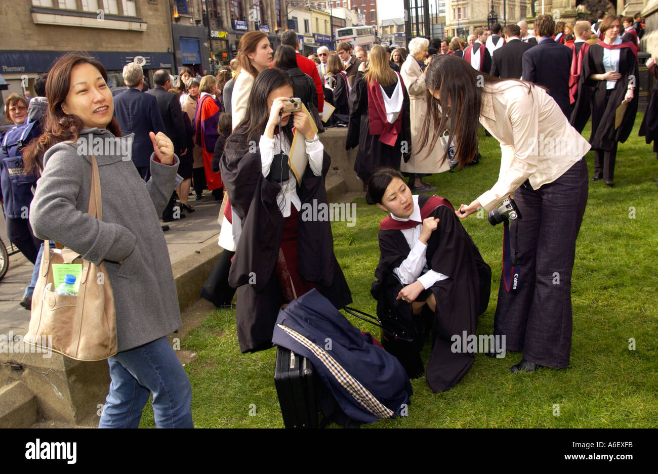 Students with friends and family after receiving their degrees at a ceremony in Bristol University England UK EU Stock Photo