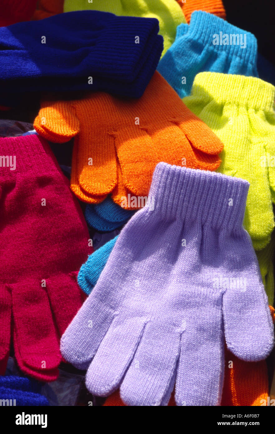Colourful wool gloves on a market stall Stock Photo