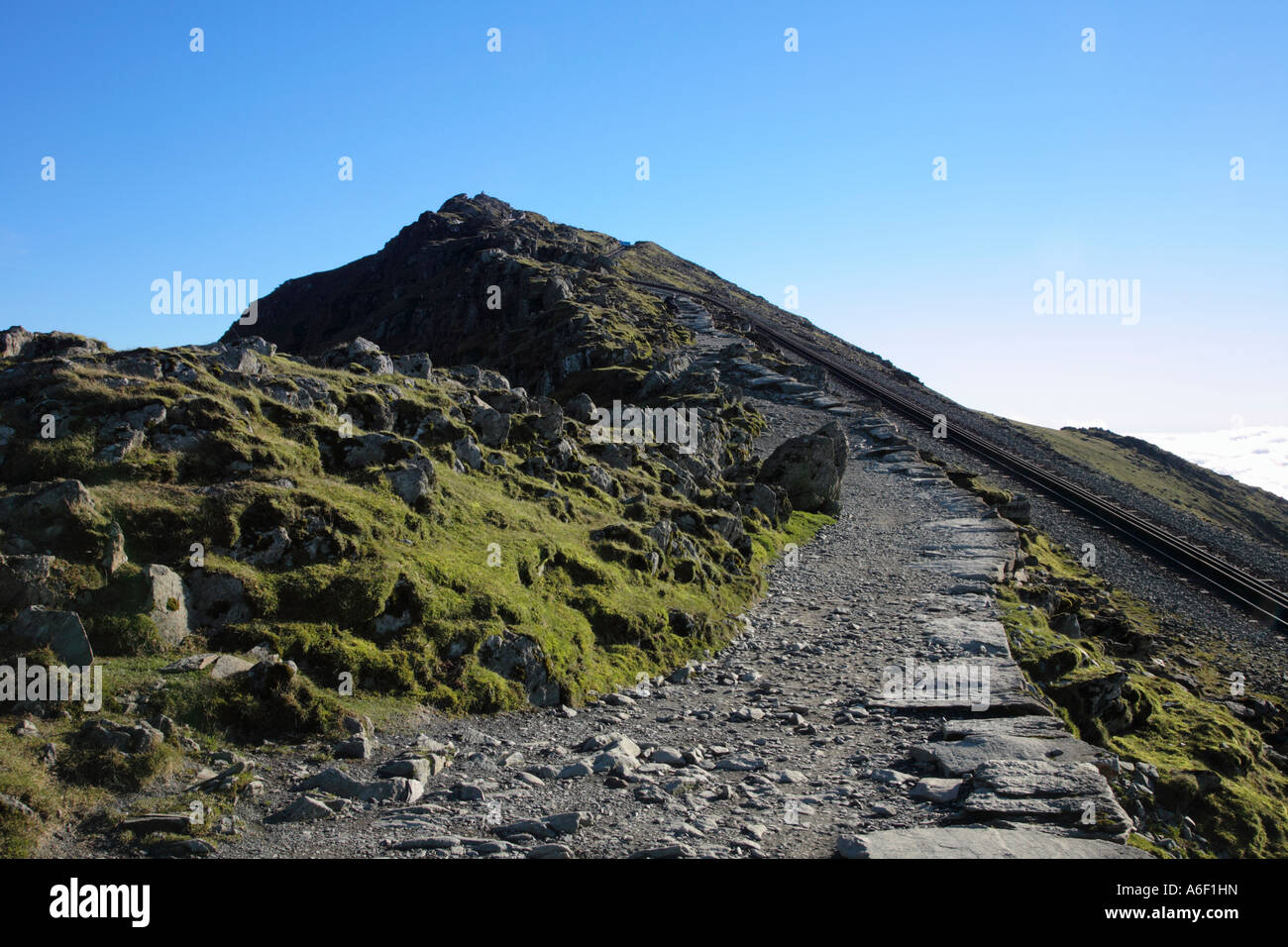 Final approach to the Summit of Mt Snowdon Yr Wyddfa following the railway track Snowdonia National Park Gwynedd Wales Stock Photo