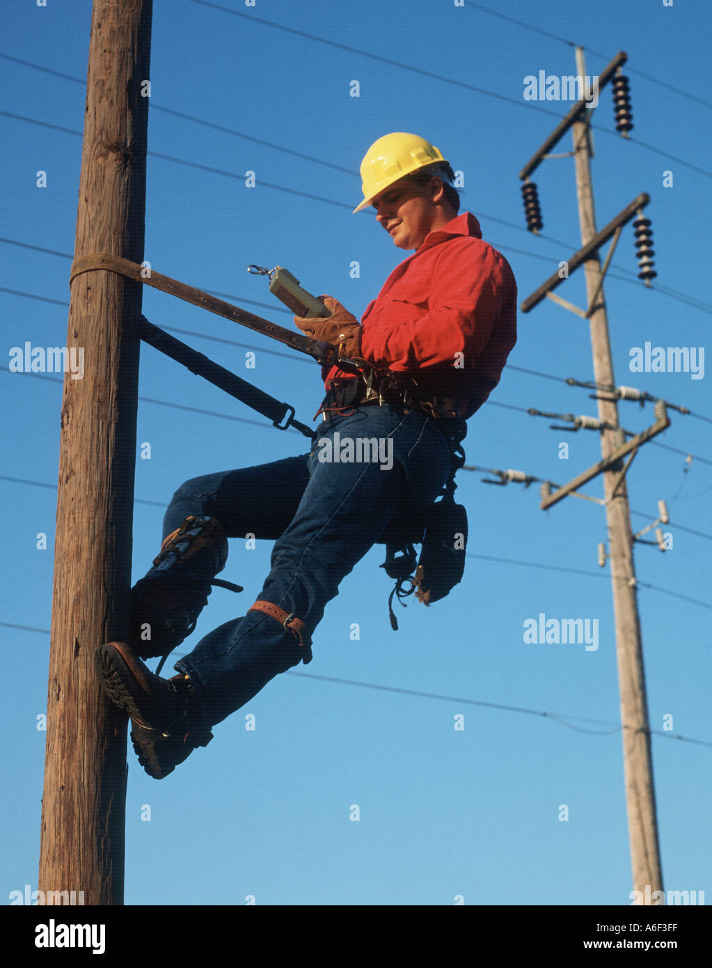 telephone lineman working on pole Stock Photo - Alamy