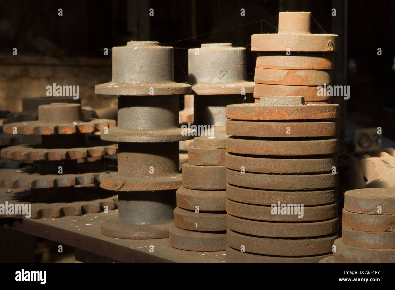 Cast iron spoked wheels & belt pulleys, California Stock Photo