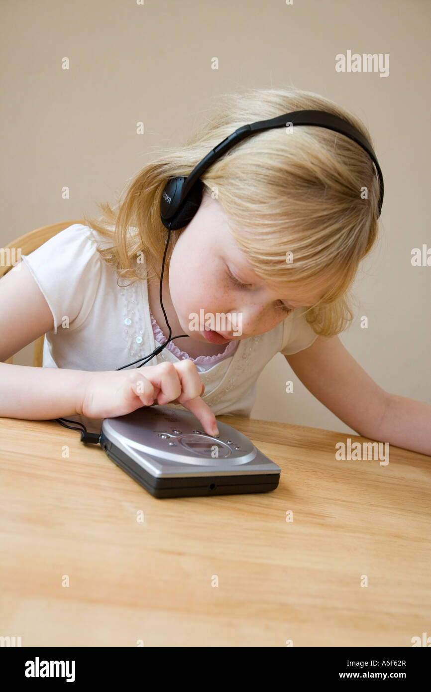 Young girl listens to music on her cd player Stock Photo