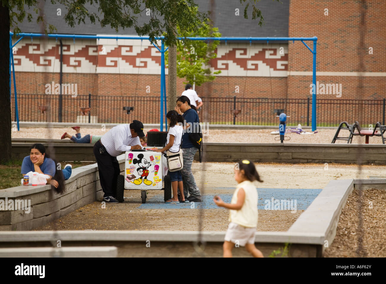 ILLINOIS Chicago Children buy ice cream from vendor in park playground