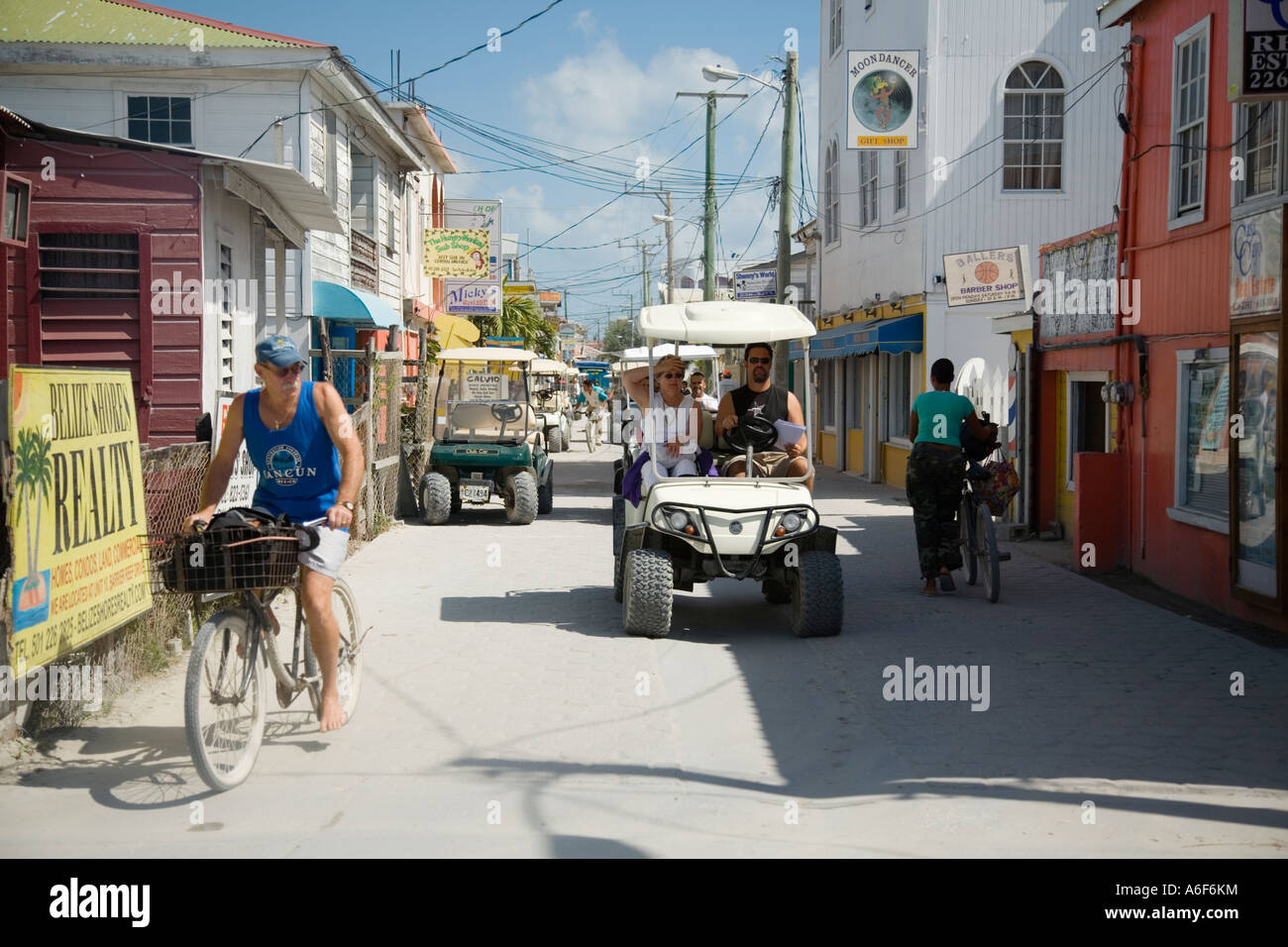 BELIZE Ambergris Caye Golf carts and bicycles on street in San Pedro