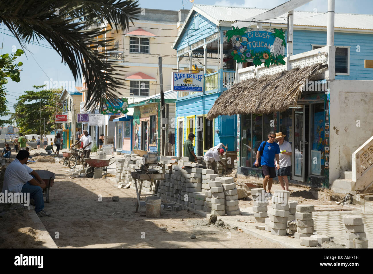 BELIZE San Pedro on Ambergris Caye Workmen pave downtown street