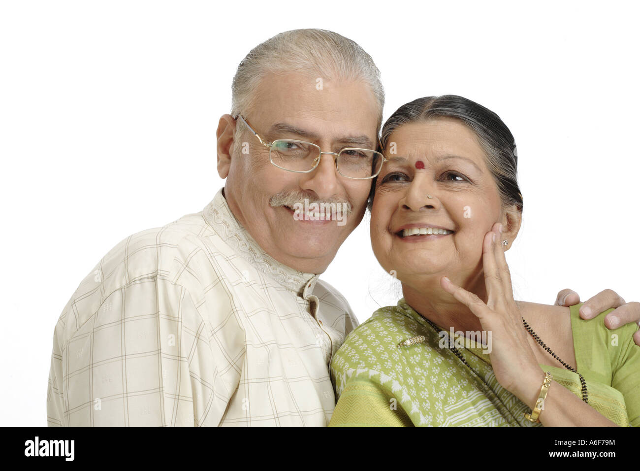 Old happy couple old man wearing Kurta Pajama specs glasses old lady wearing light green coloured Gujrathi style Saree Stock Photo