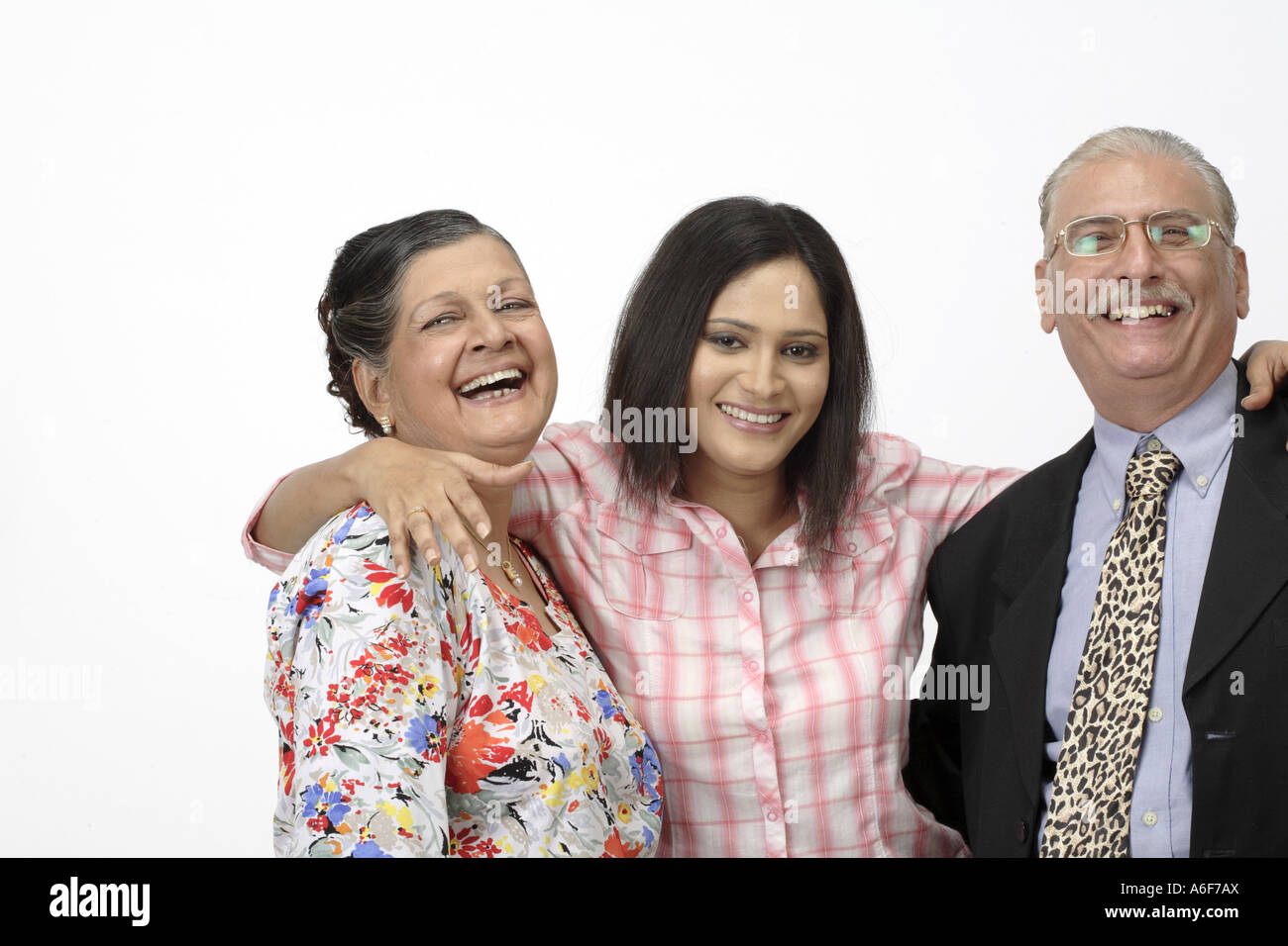 Senior citizens and a Young Girl old man wearing suit tie glasses old woman wearing trousers top with full sleeves Stock Photo