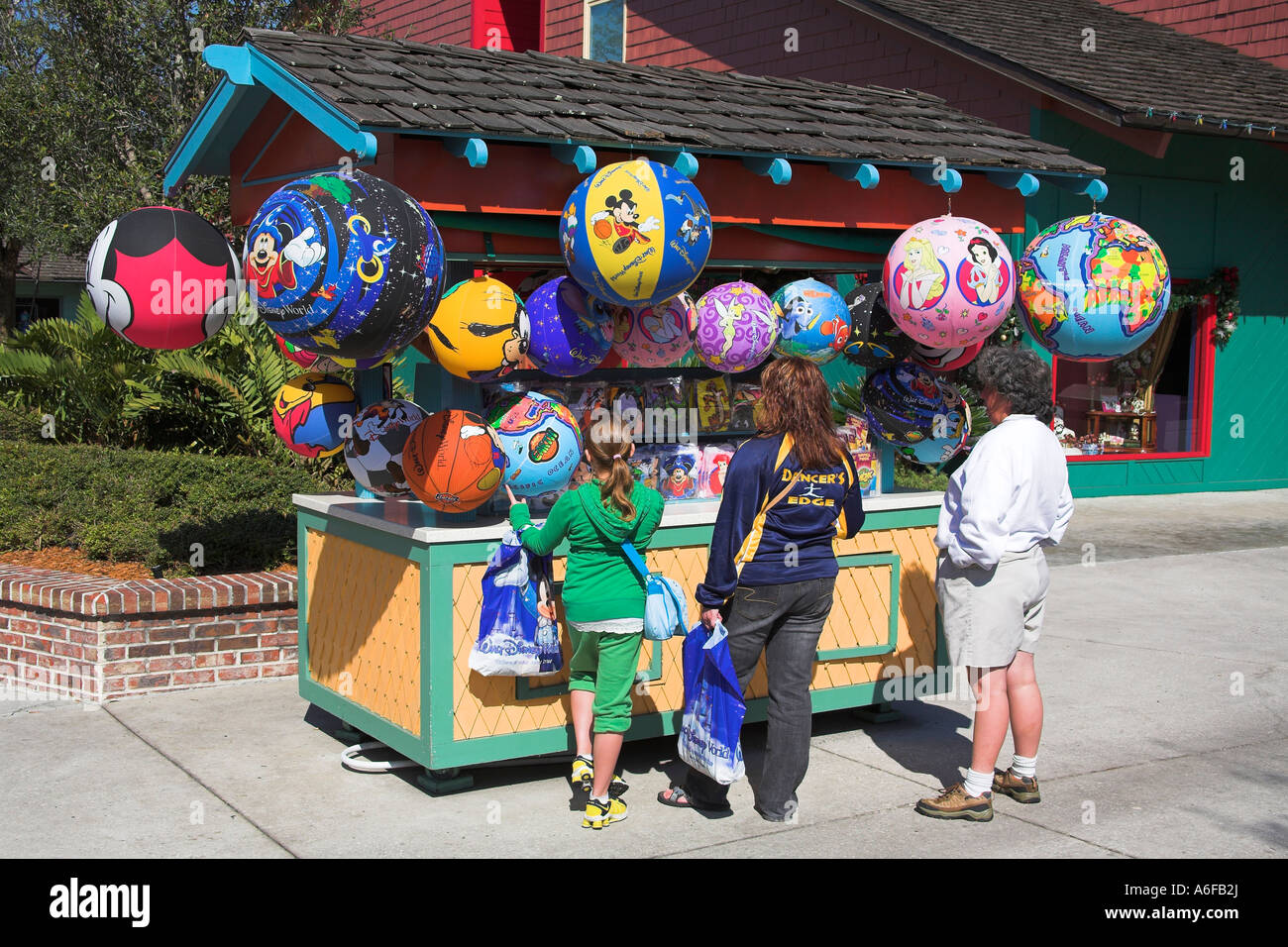 Large inflated balloons for sale on stall, and customers, Downtown