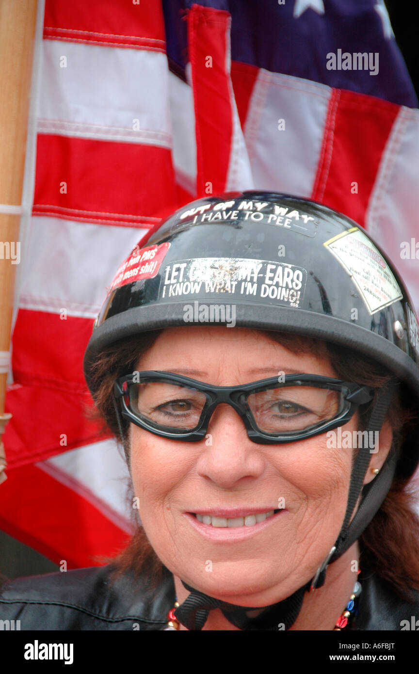 Vietnam vet woman and cycle helmet and flag biker chick Stock Photo