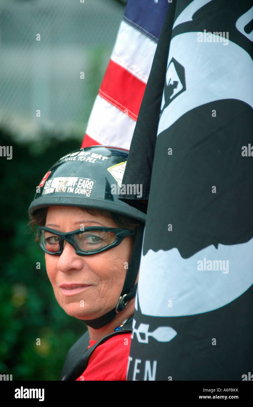 Vietnam vet woman and cycle helmet and flag biker chick POW Stock Photo