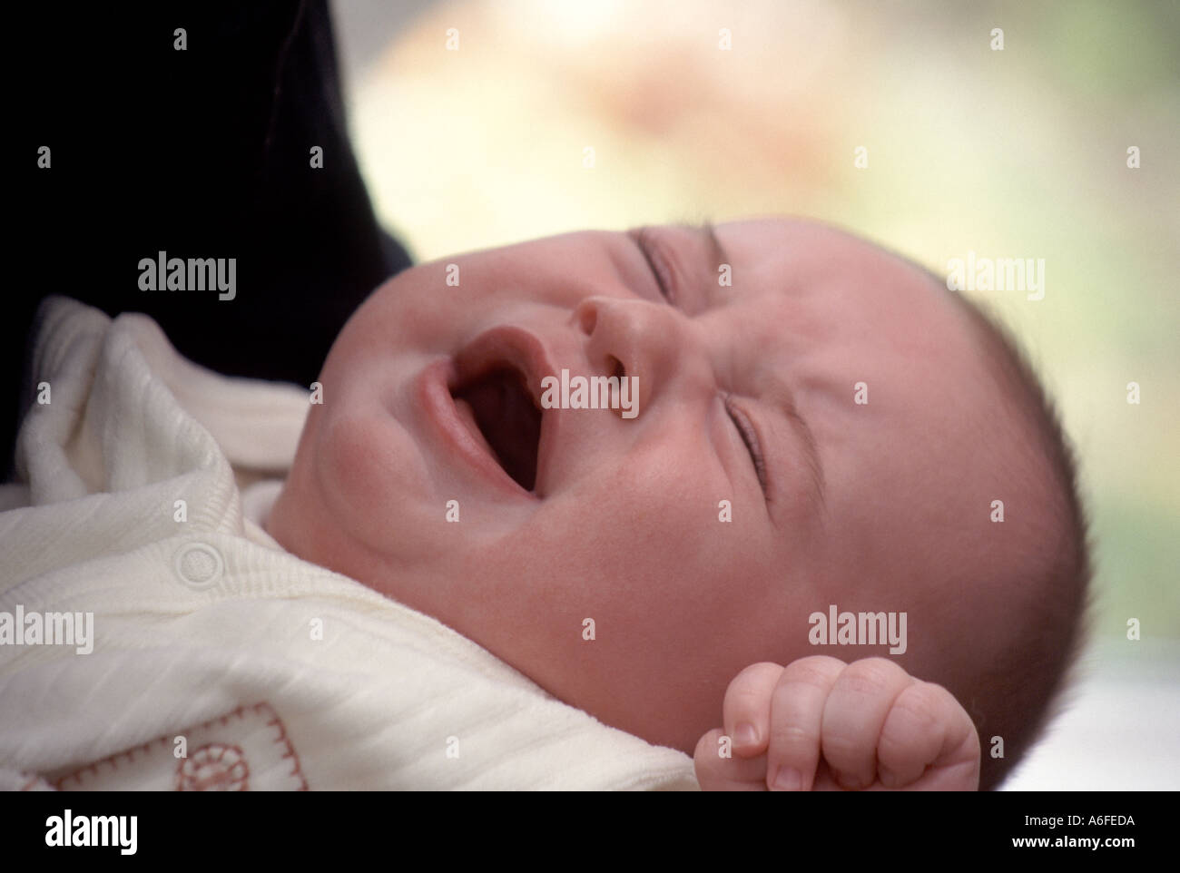 Baby boy crying close up19 week old model released child held by mother ...