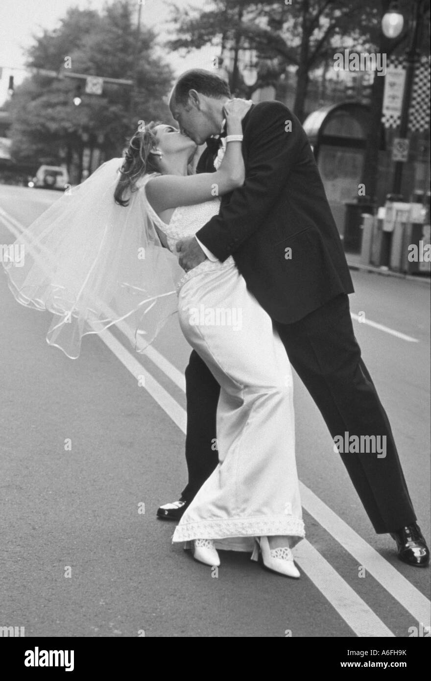 Newly weds kissing Stock Photo