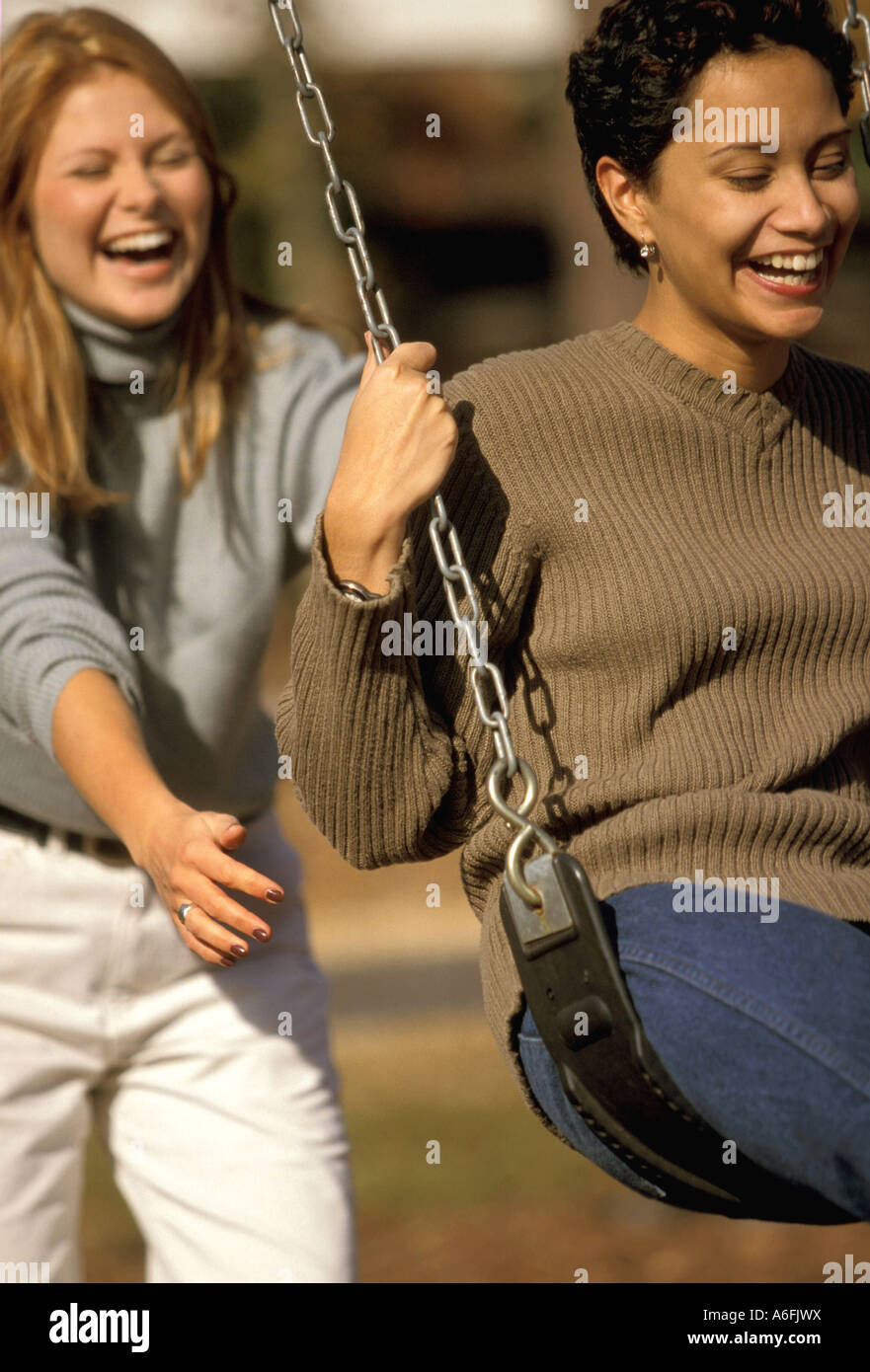 Women on swing Stock Photo - Alamy