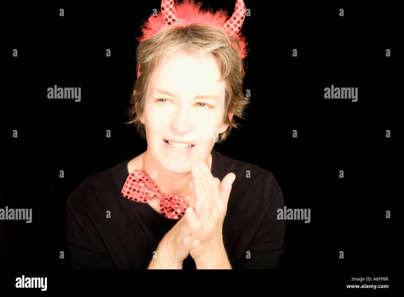 Woman wearing red devil hi-res stock photography and images - Alamy