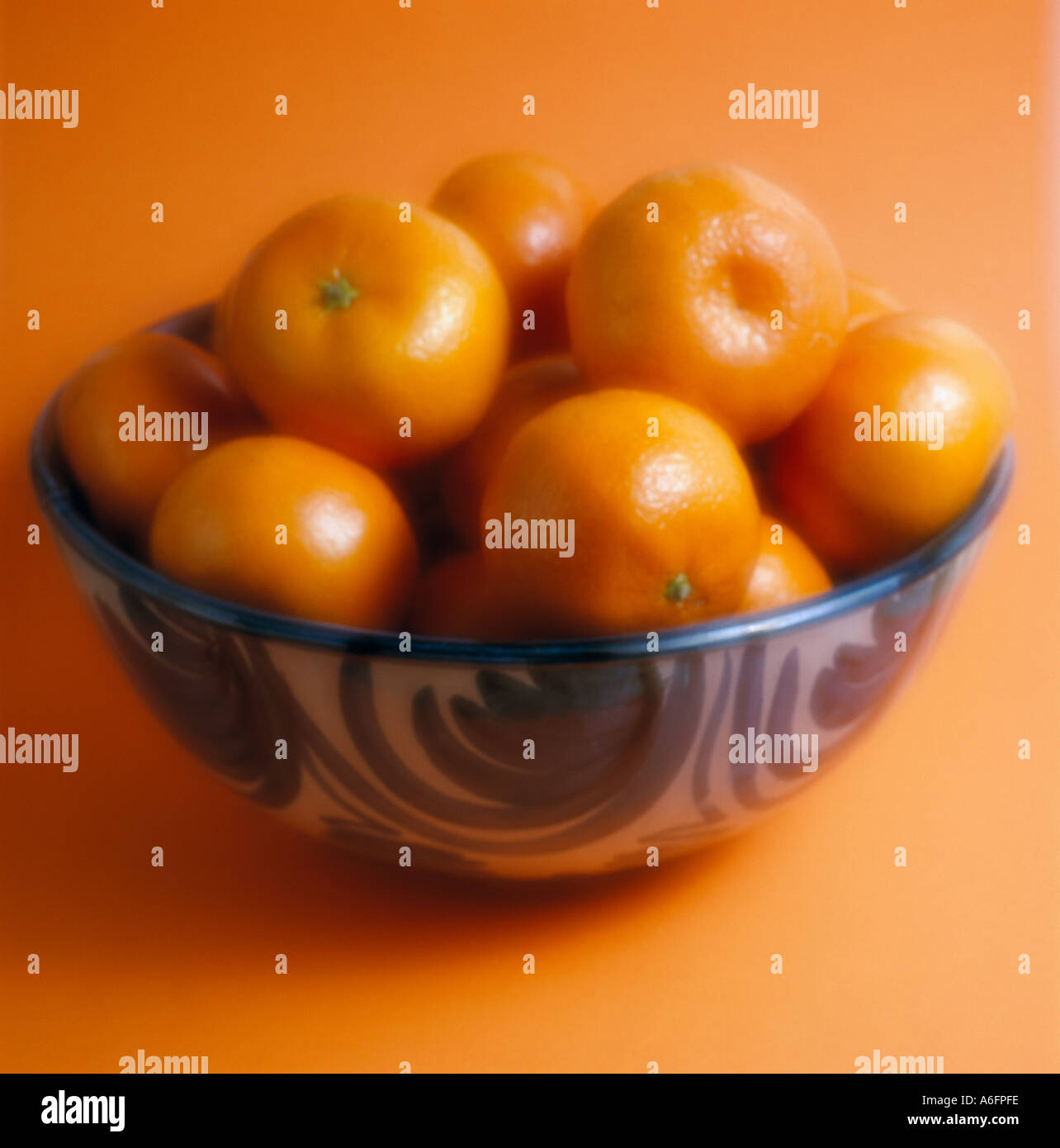 Oranges in bowl Stock Photo