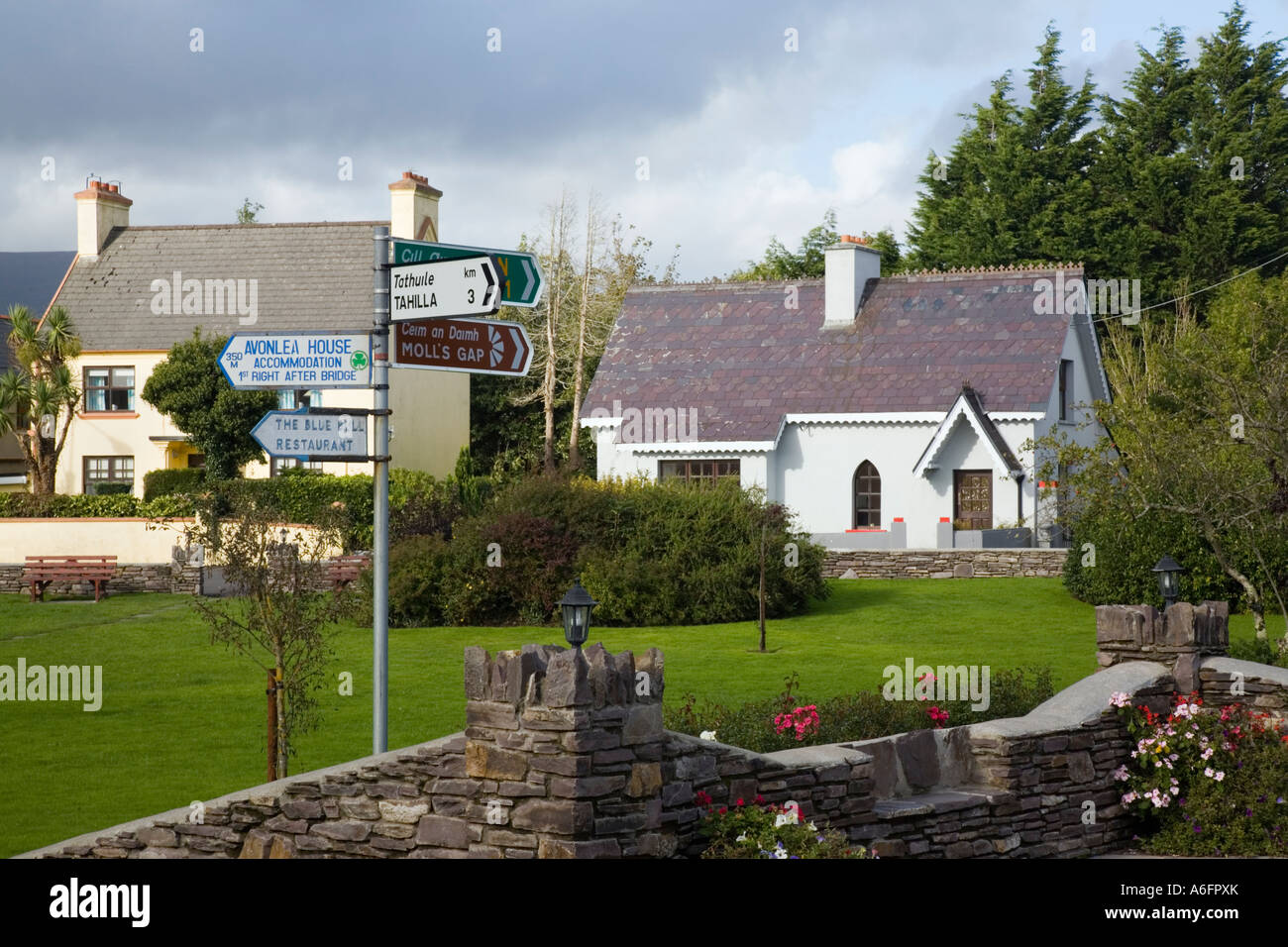 Sneem Co Kerry Eire Ireland South Square with tourist signpost and Kerry Geopark Heritage Information Centre Stock Photo